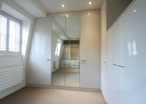 white gloss unit wardrobe with mirrors
