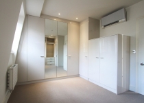 white gloss walk-in wardrobe